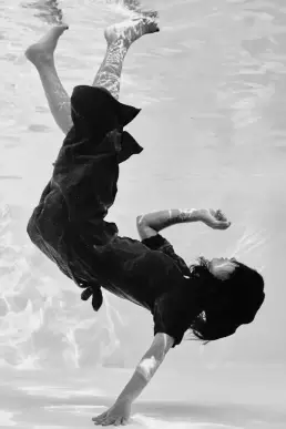 woman red dress underwater editorial