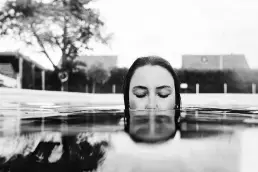 woman red dress underwater editorial
