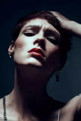 woman red lips rock smokey eyes attitude