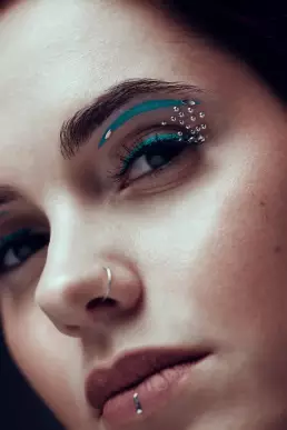 woman blue makeup brown eye